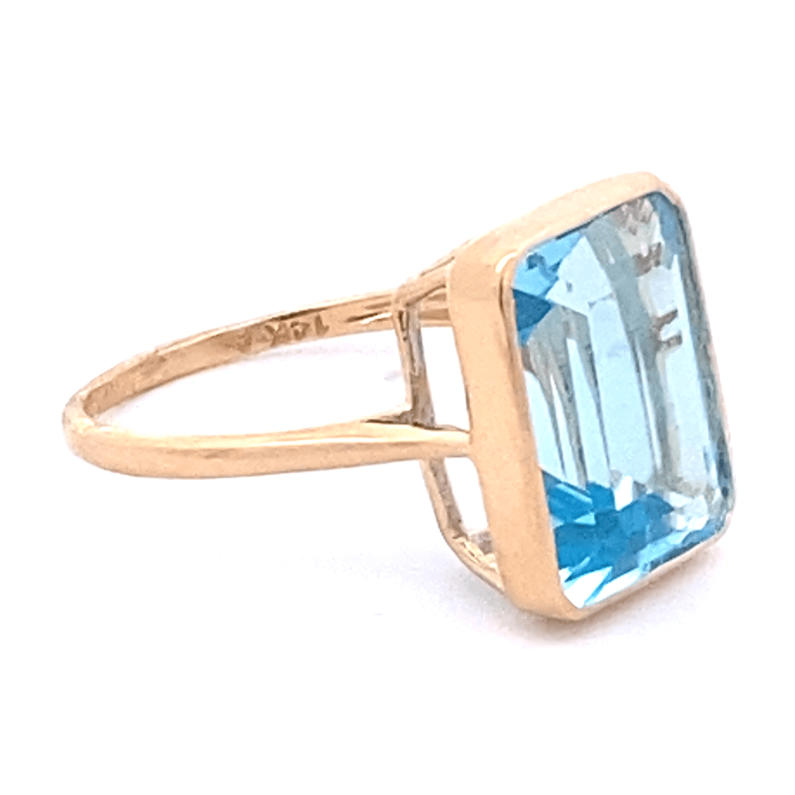 Ring blue topaz emerald cut bezel - Gaines Jewelers