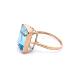 Ring blue topaz emerald cut bezel - Gaines Jewelers