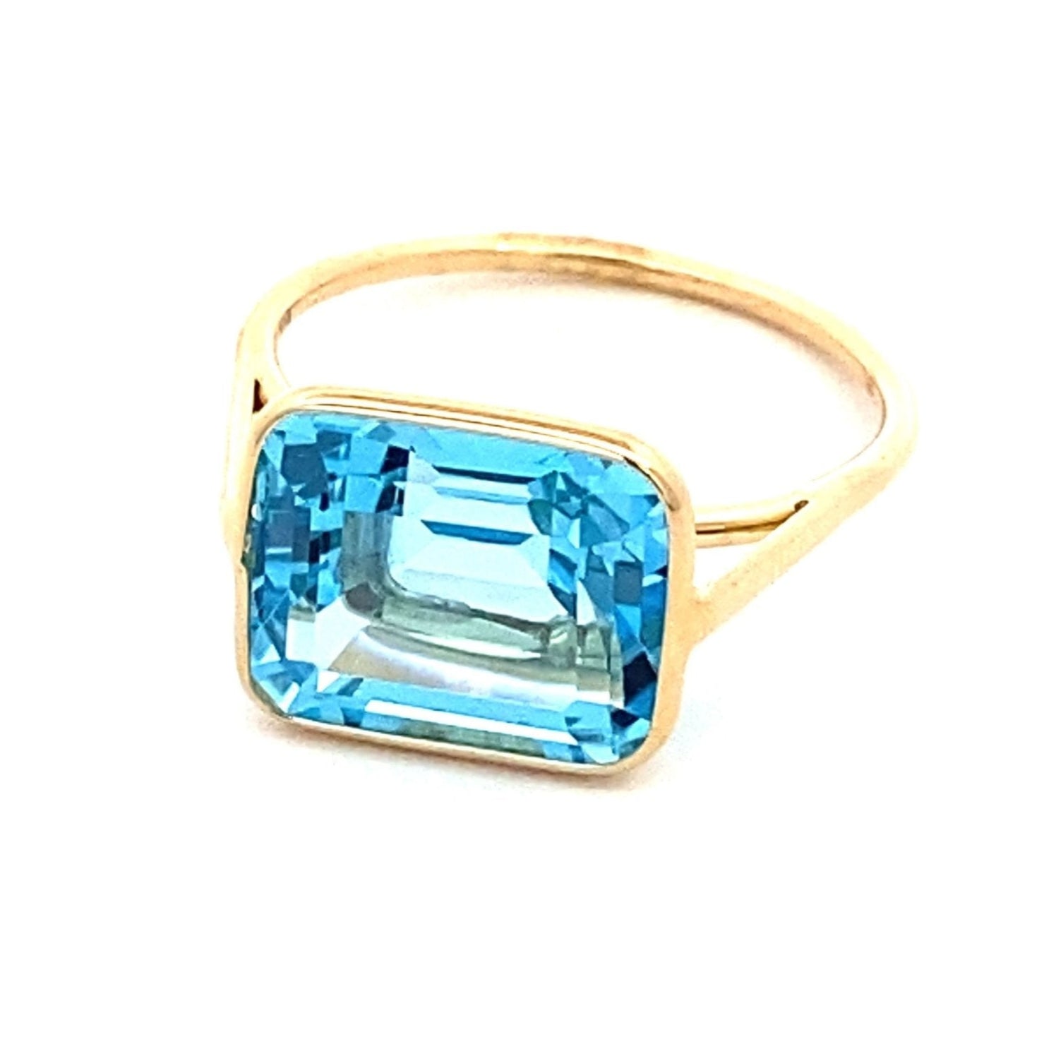 Ring emerald cut Sky blue topaz in bezel - Gaines Jewelers