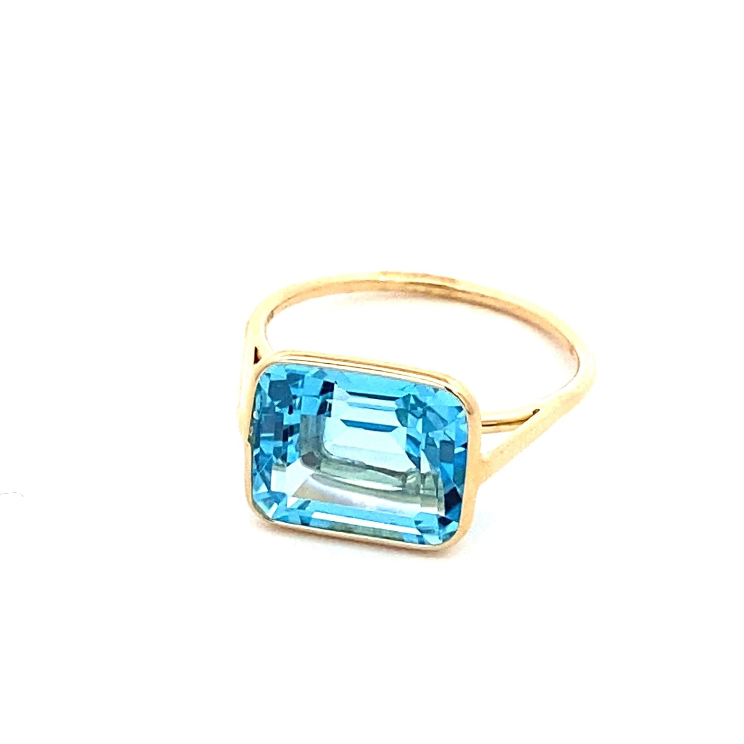 Ring emerald cut Sky blue topaz in bezel - Gaines Jewelers