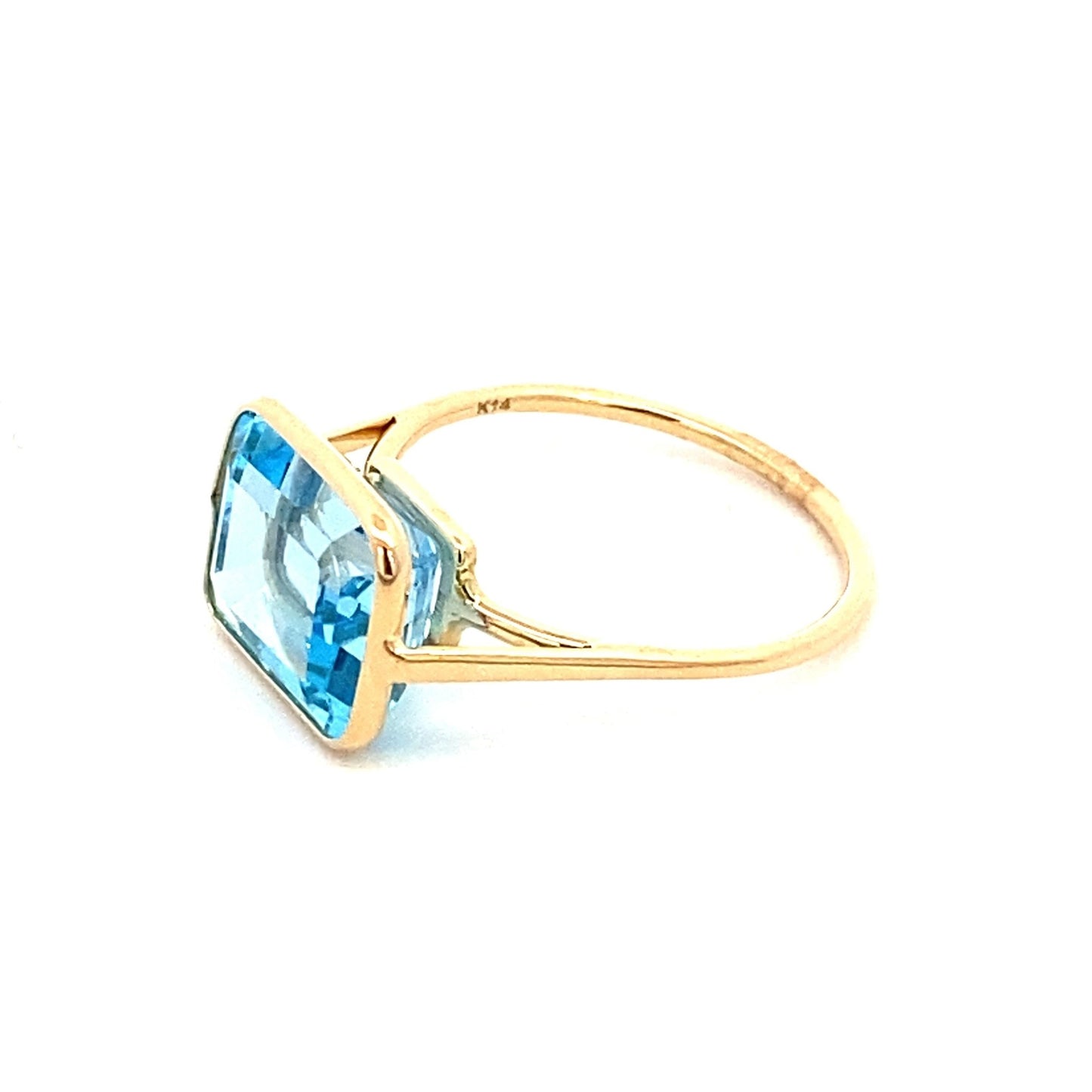 Ring emerald cut Sky blue topaz in bezel - Gaines Jewelers